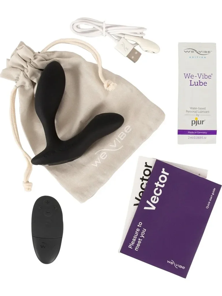 We-Vibe Vector+ med fjärrkontroll, laddkabel och förvaringspåse.